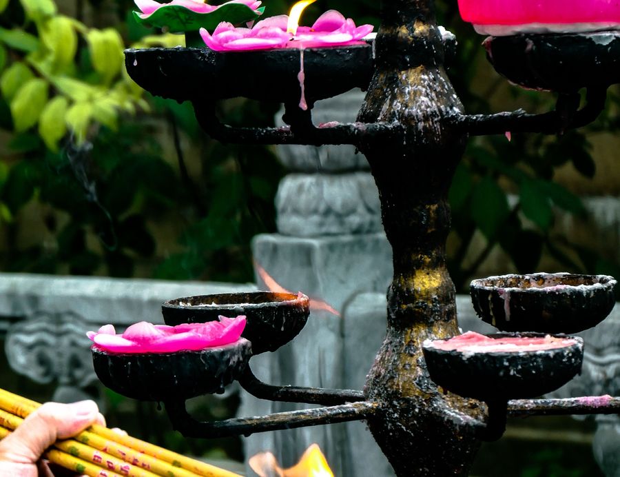 Balanced zen stones with a candle and lotus